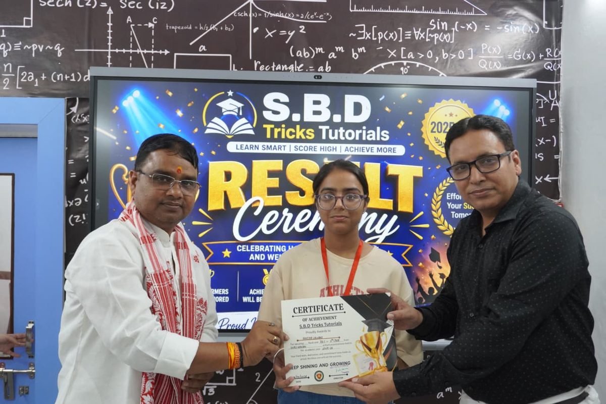 Student receiving a certificate from mentors at the result ceremony