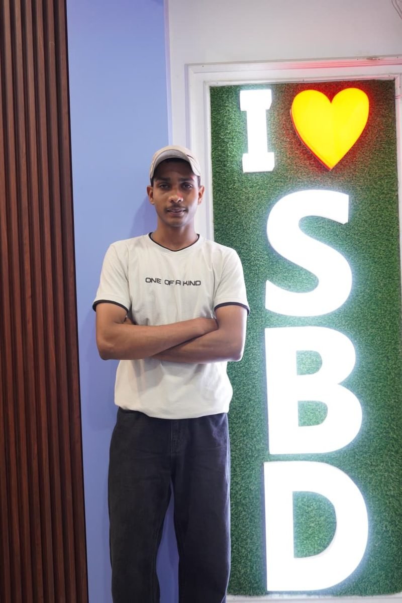 Student at the I love SBD wall