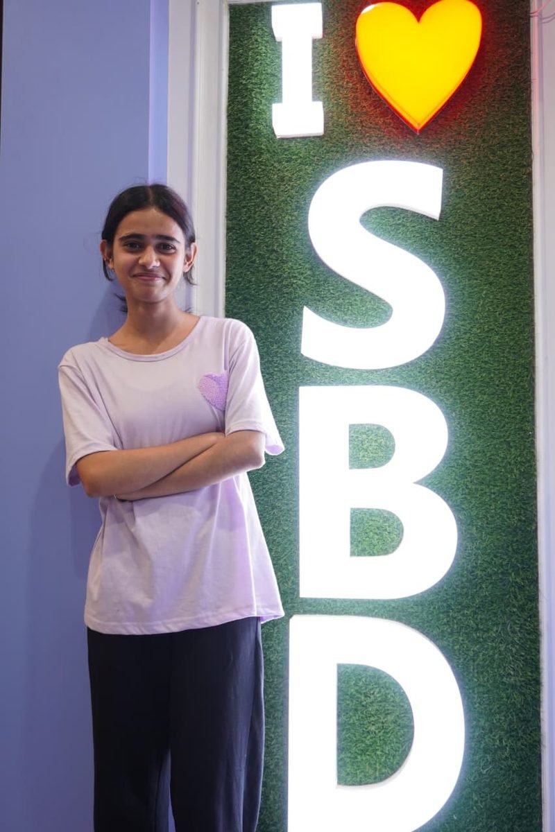 Student at the I love SBD wall