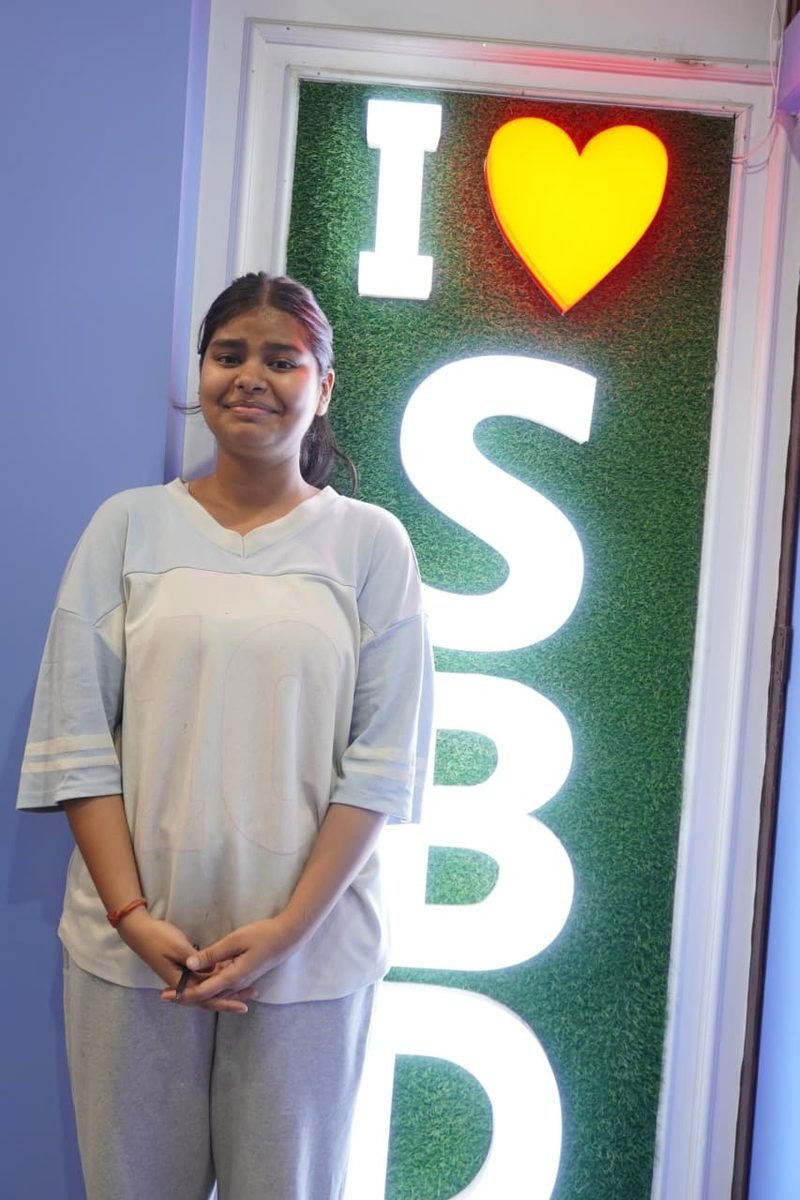 Student at the I love SBD wall