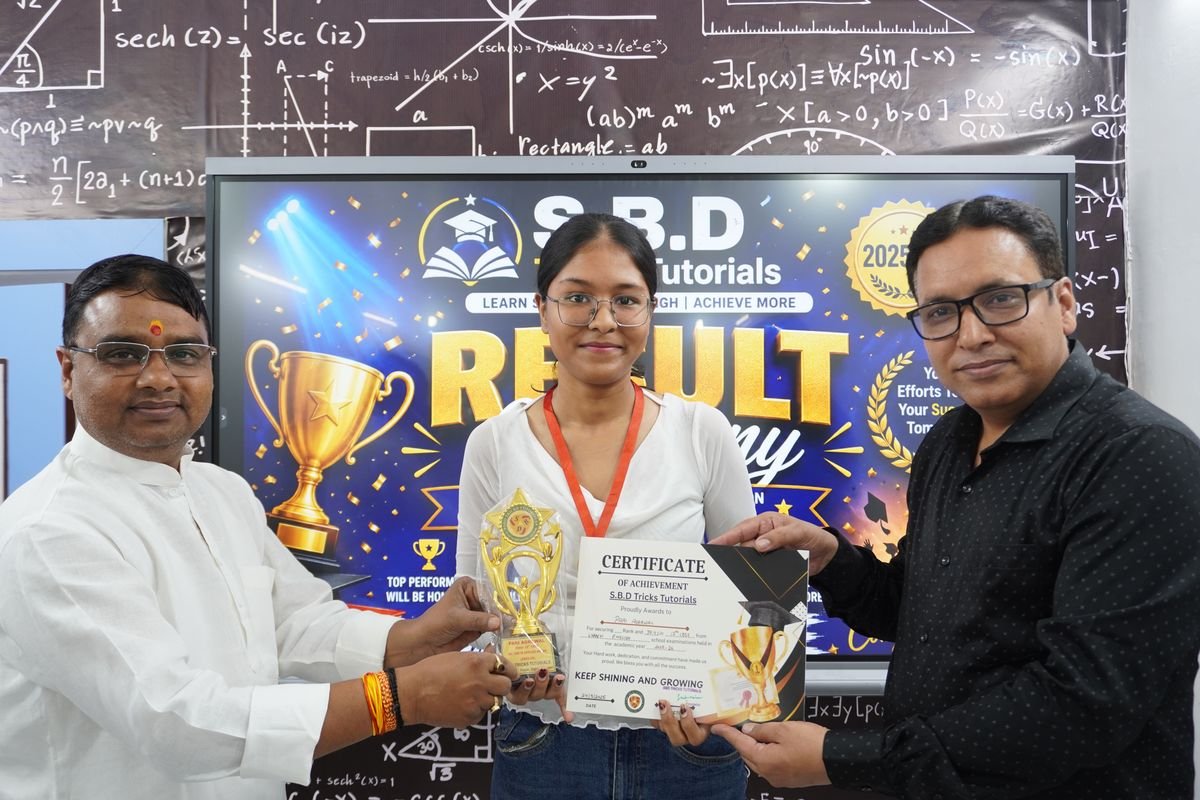 A student receiving an achievement certificate and trophy