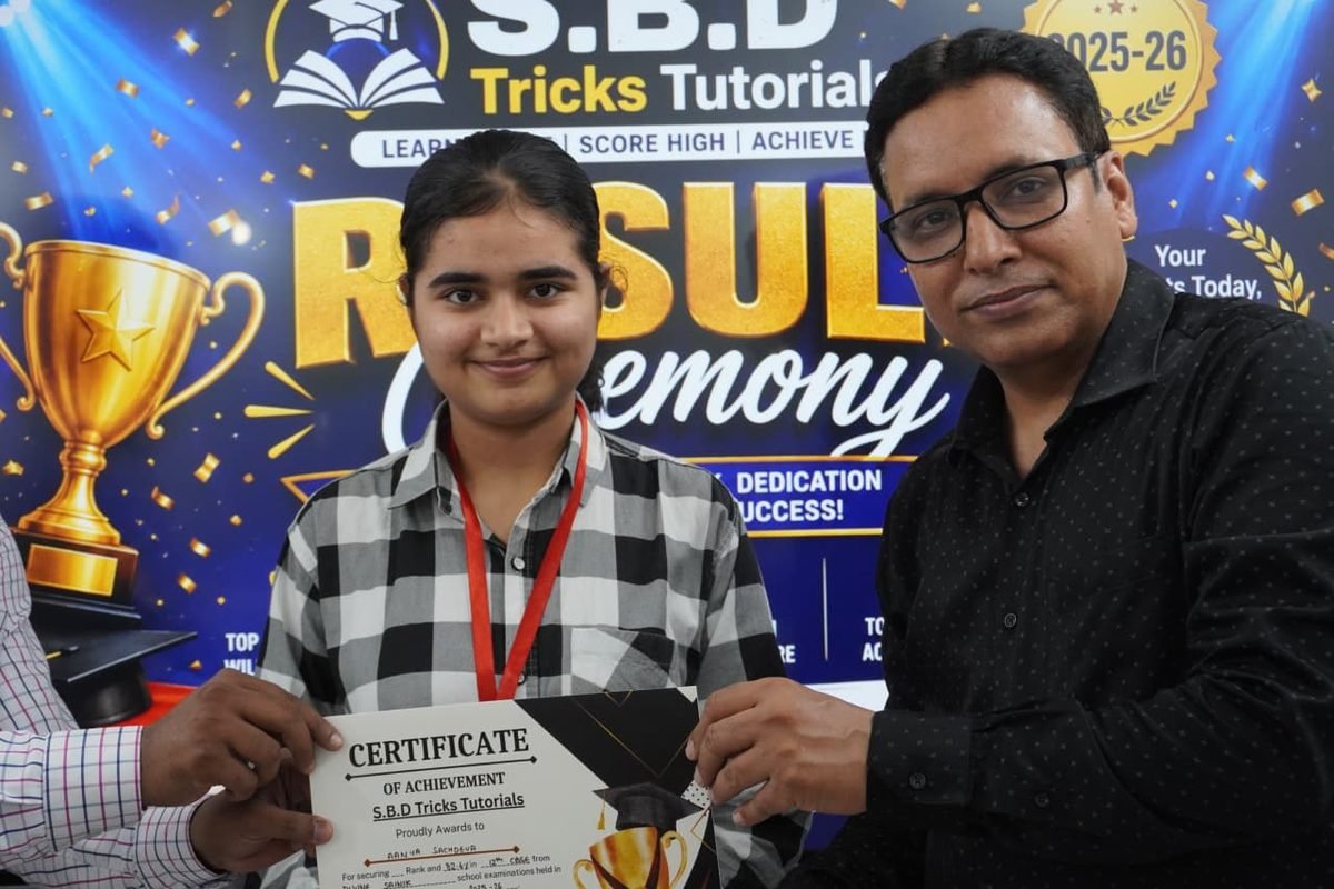 Student receiving an achievement certificate at the SBD result ceremony